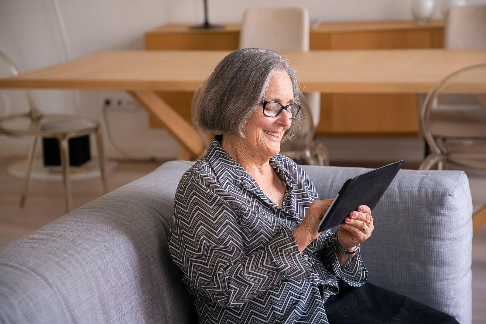 An older person using a tablet