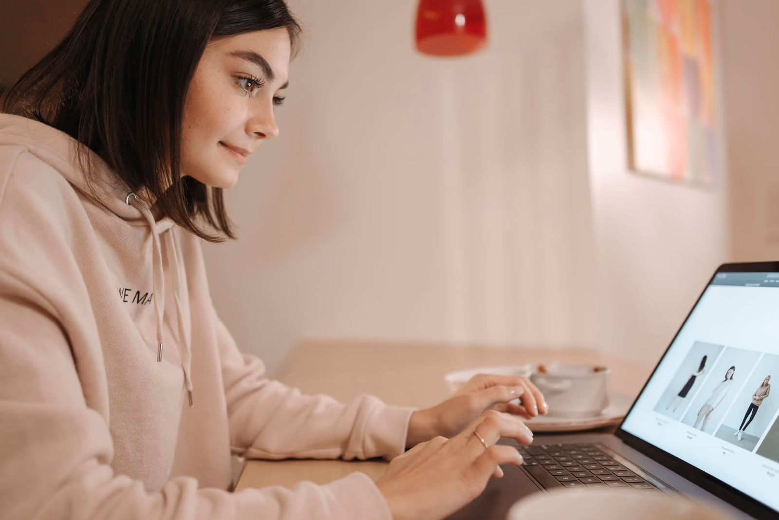 Browsing an online clothing store on a laptop