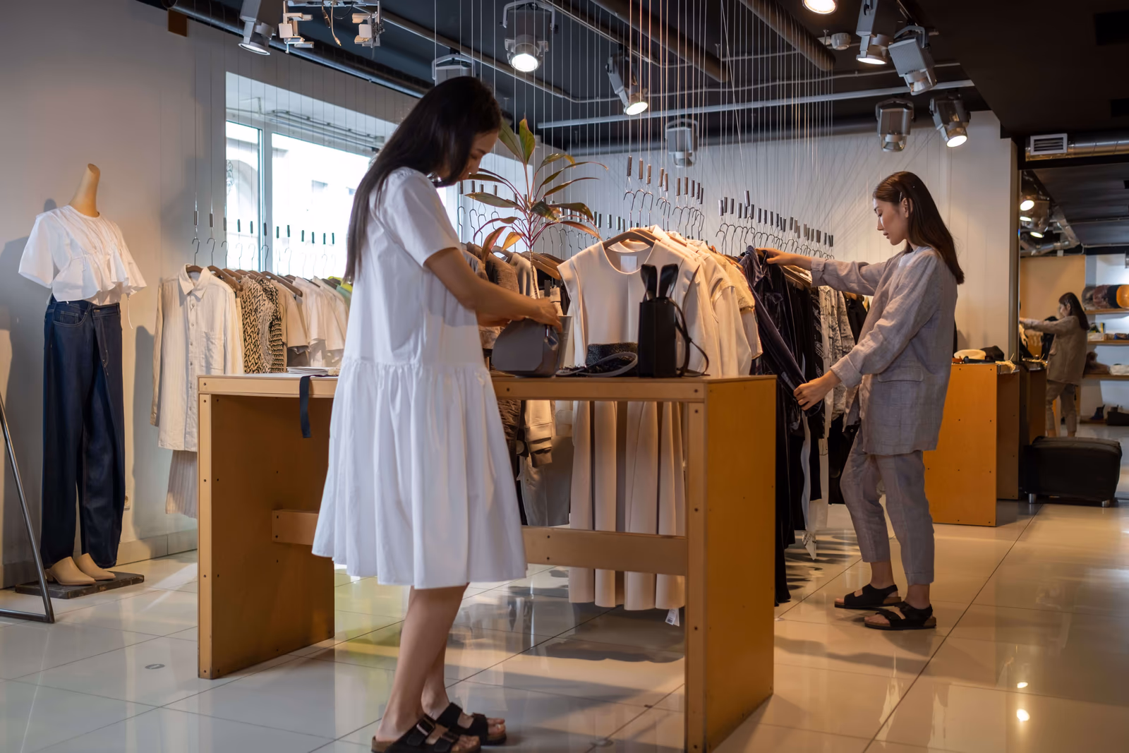 Two people shopping for clothing