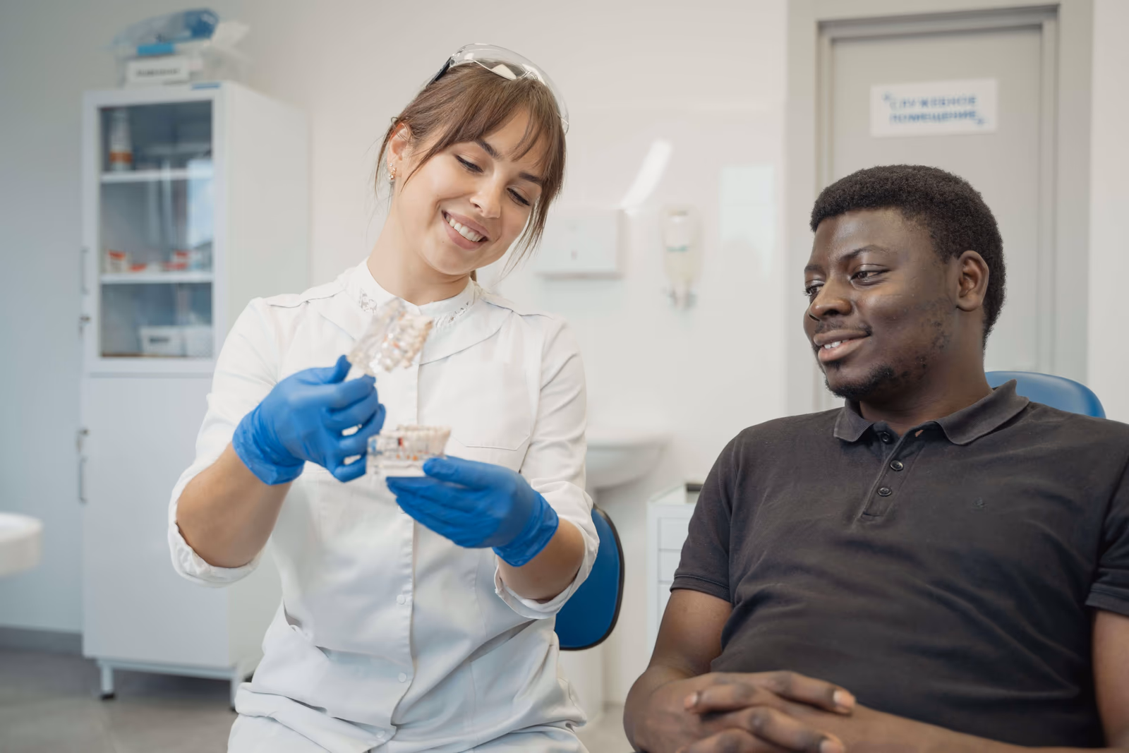 A dentist explaining treatment to a patient