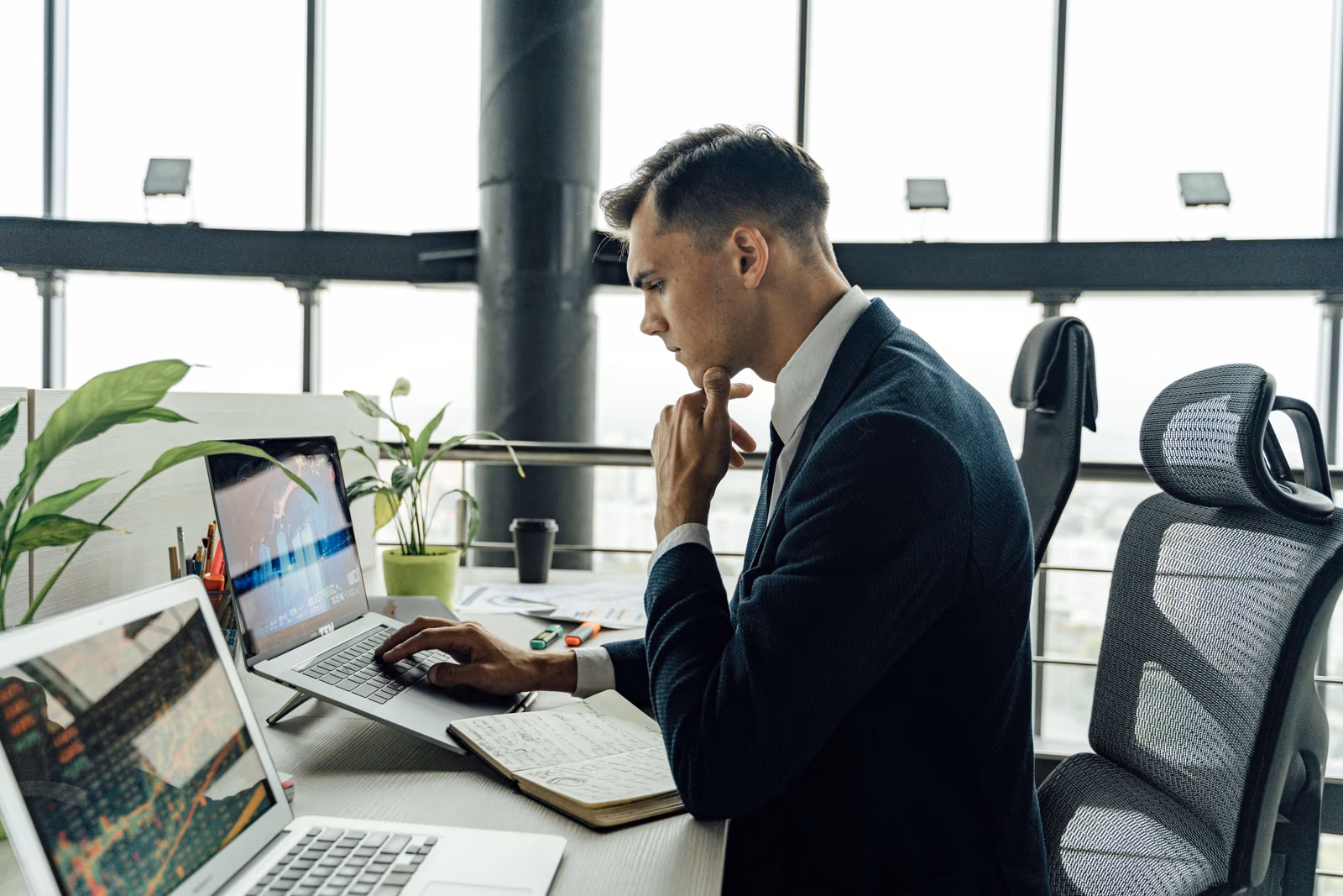 A financial advisor working on a laptop