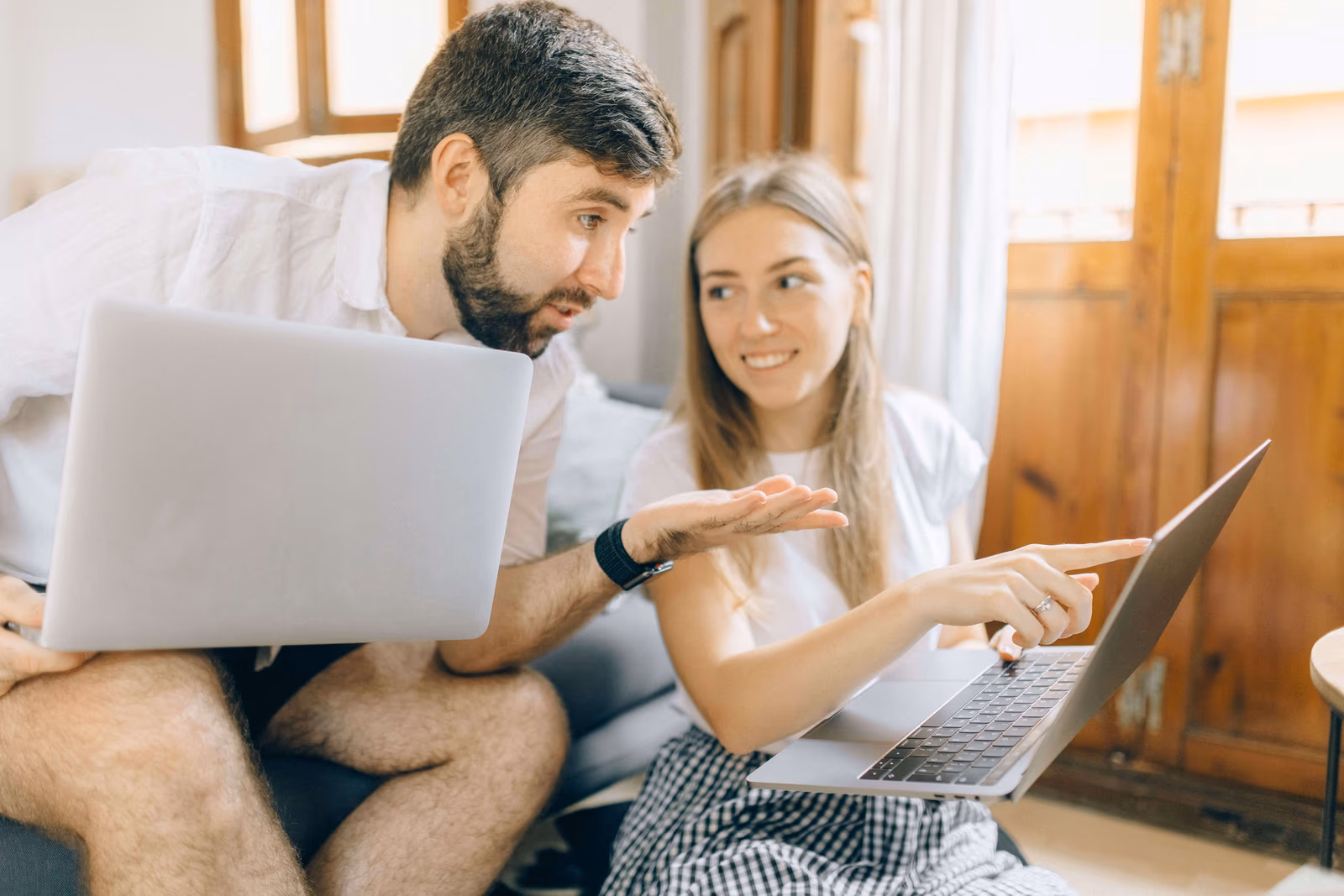 A couple comparing insurance options on a laptop