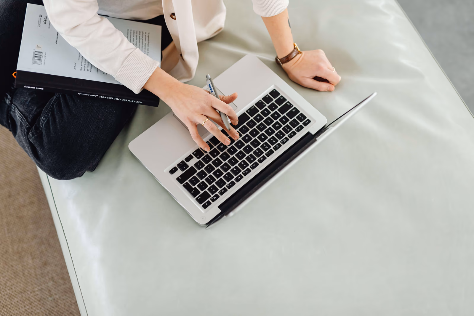 A person working through an online form with a laptop